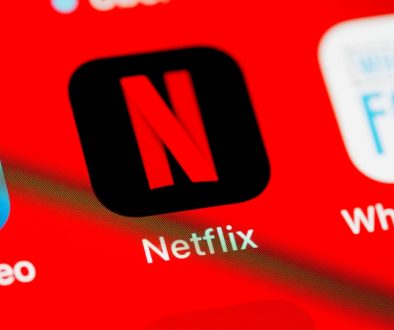 a close up of a red screen with different logos netflix slow buffering wifi speed fail