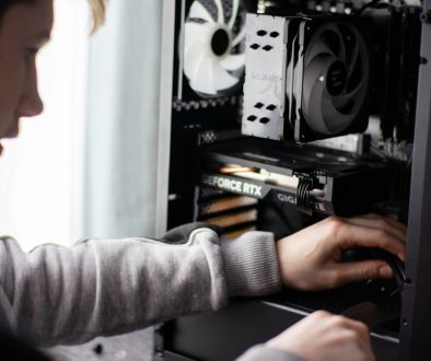 A man is working on a computer in a room computer maintenance, error prevention, antivirus update