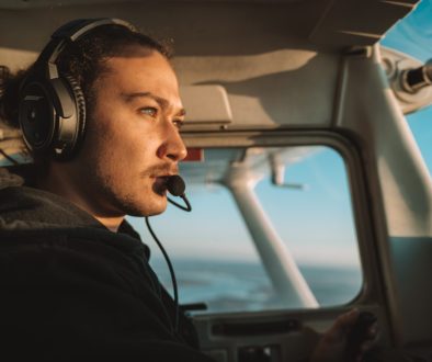 a man wearing headphones sitting in the cockpit of a plane microsoft copilot, salesforce crm, ai assistant a man wearing headphones sitting in the cockpit of a plane microsoft copilot, salesforce crm, ai assistant