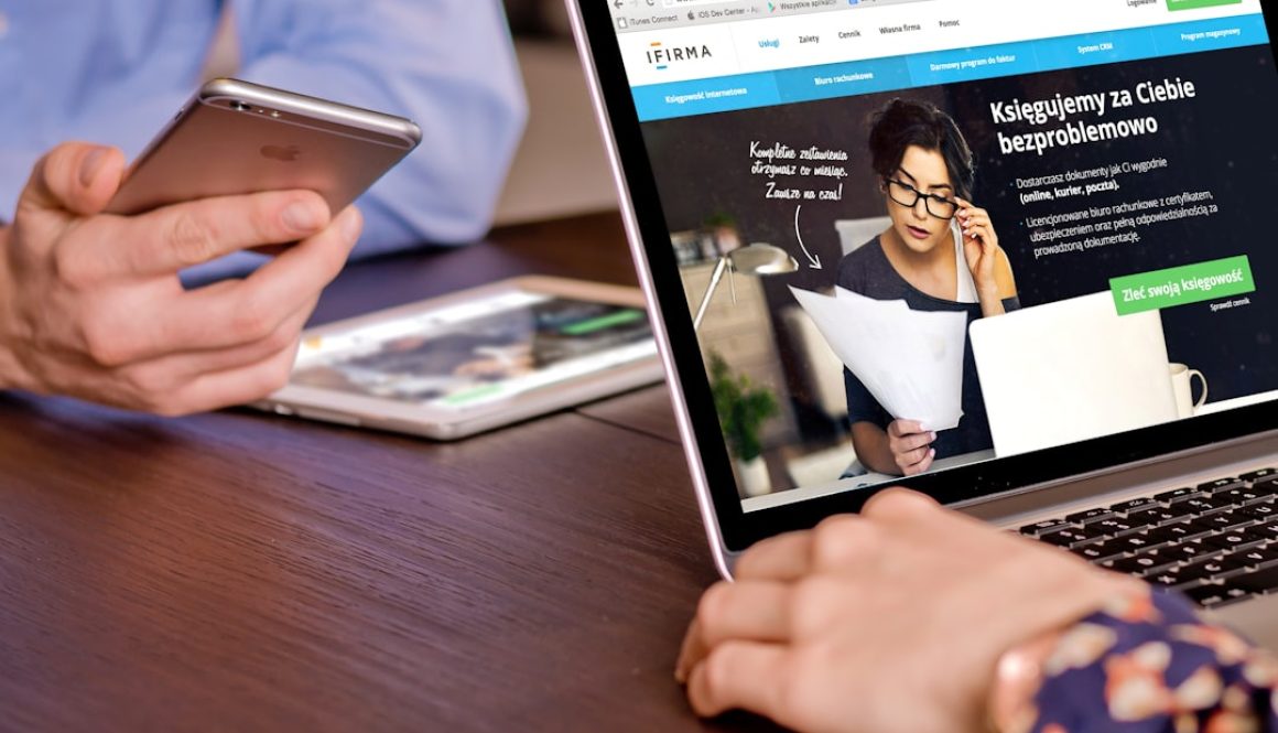 a person on a cell phone and a laptop on a table mercari app, online selling, ecommerce fees a person on a cell phone and a laptop on a table mercari app, online selling, ecommerce fees