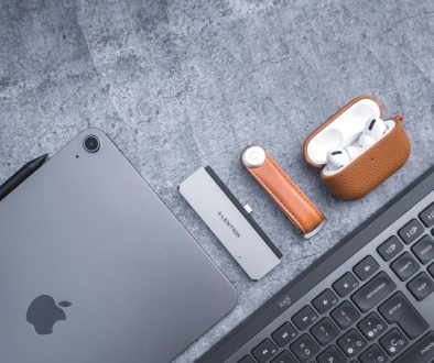 an apple laptop computer sitting next to a keyboard macbook battery health settings, battery preferences, macos ui