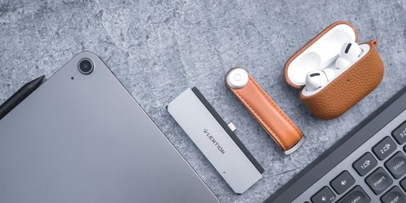an apple laptop computer sitting next to a keyboard macbook battery health settings, battery preferences, macos ui