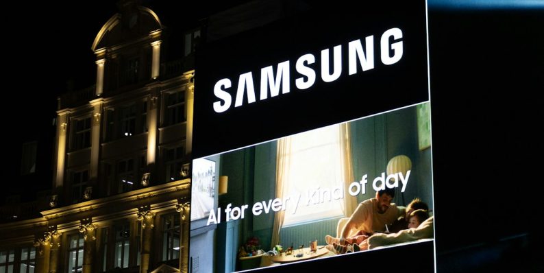 Samsung billboard at night in a city samsung tv settings, firmware update, smart tv interface