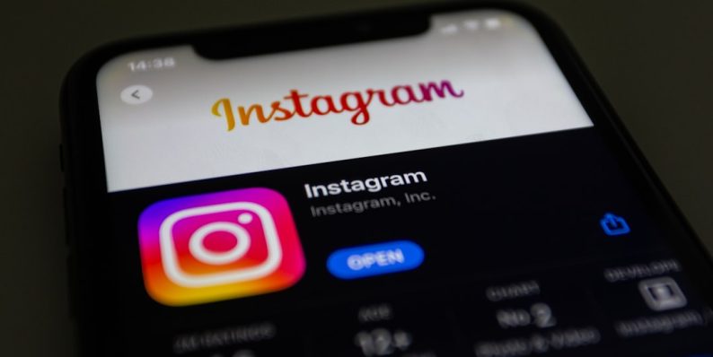 the instagram logo is displayed on an iphone instagram disabled account, user profile ban, social media restriction