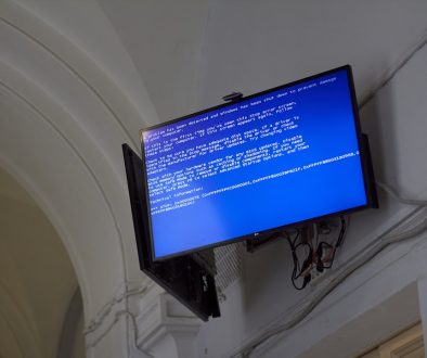 The TV displays a blue screen of death. windows error message, zip extraction, 0x80010135
