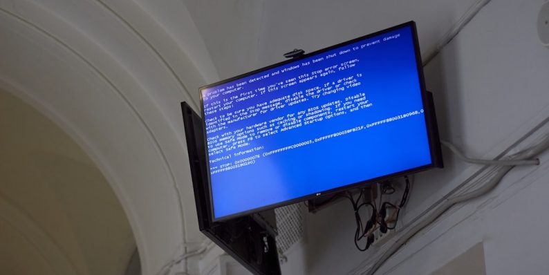 The TV displays a blue screen of death. windows error message, zip extraction, 0x80010135