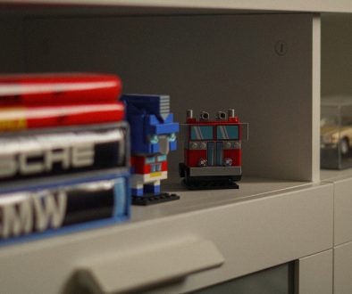 Two brick-built robot figures on a shelf. repair microsoft office control panel