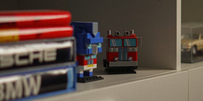 Two brick-built robot figures on a shelf. repair microsoft office control panel