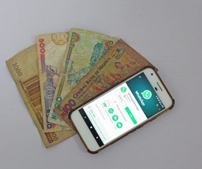 white Android smartphone beside banknotes venmo app phone friends money