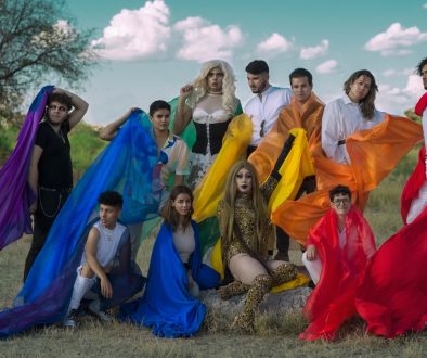 a group of people posing for a picture in a field lgbtq fashion, youtube content creators, social media censorship