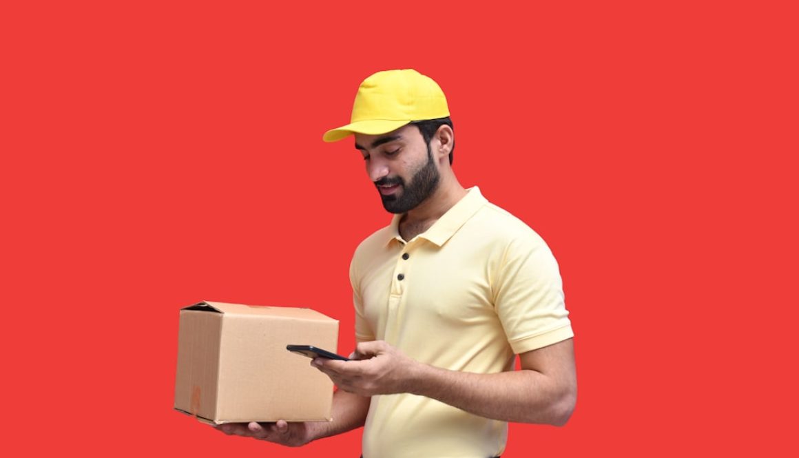 a man in a yellow hard hat holding a phone inventory restock, cancelled order notification, ecommerce workflow a man in a yellow hard hat holding a phone inventory restock, cancelled order notification, ecommerce workflow