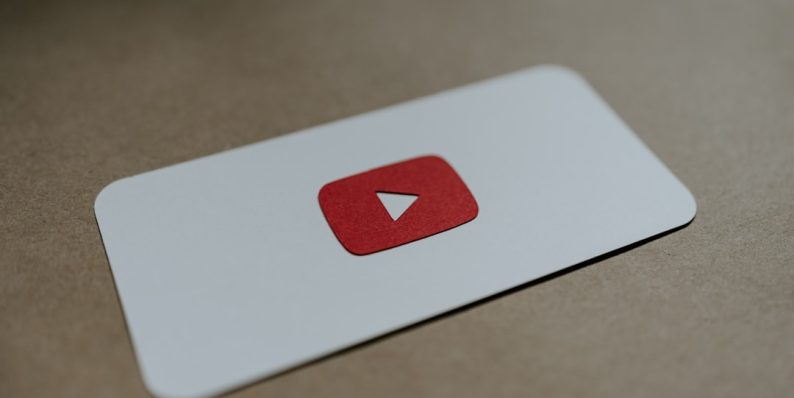 a red and white play button on a white card youtube recovery, account security, forgotten credentials