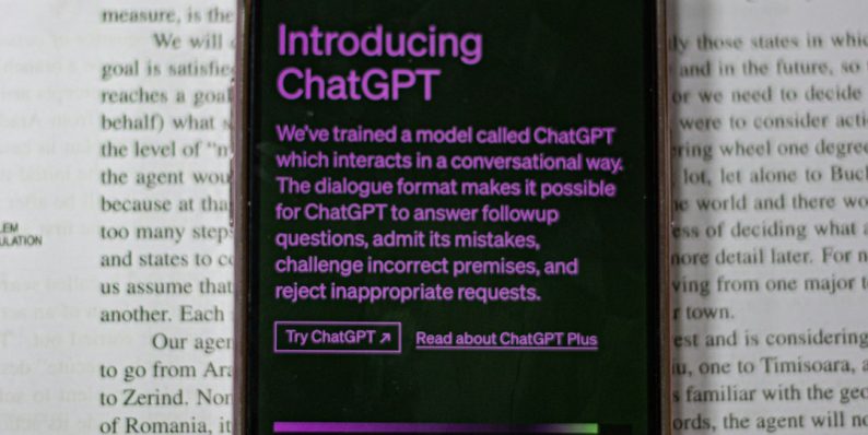 a cell phone sitting on top of an open book chatgpt interface branching conversations example