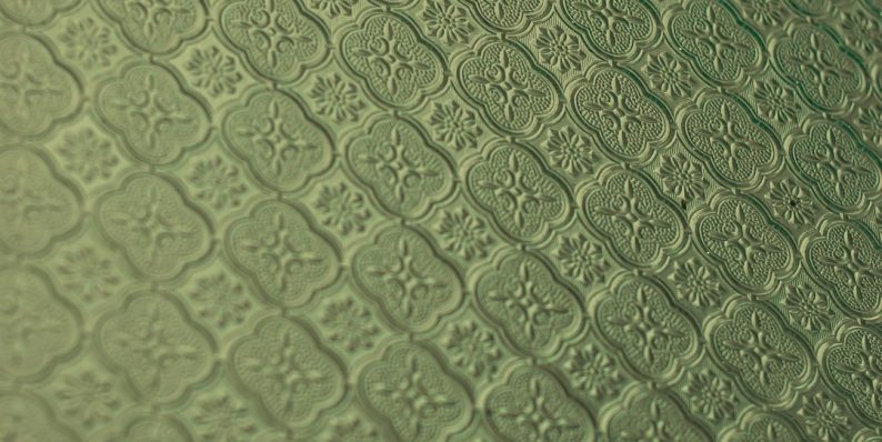 a close up of a green surface with a pattern before after background removal, product photo, clean edges