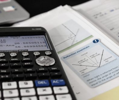 a close up of electronics math formulas, academic books, financial systems