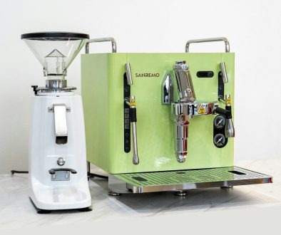 a green machine and a white machine on a table coffee equipment, french press, espresso machine, v60 a green machine and a white machine on a table coffee equipment, french press, espresso machine, v60