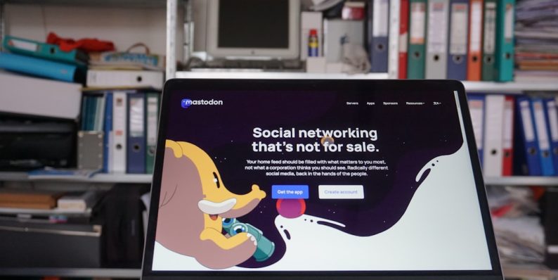 a laptop computer sitting on top of a desk social media editing, canva interface, drag and drop tool