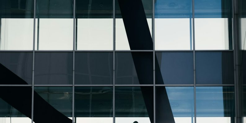 a man standing on a ledge in front of a tall building smart contract audit, defi compliance, onchain risk a man standing on a ledge in front of a tall building smart contract audit, defi compliance, onchain risk