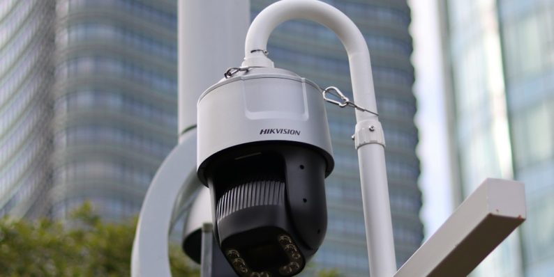 a security camera attached to a metal pole gunshot detection, urban surveillance, acoustic sensors