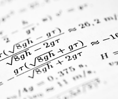 Mathematical formulas are written on a white sheet of paper. math formulas, academic books, financial systems