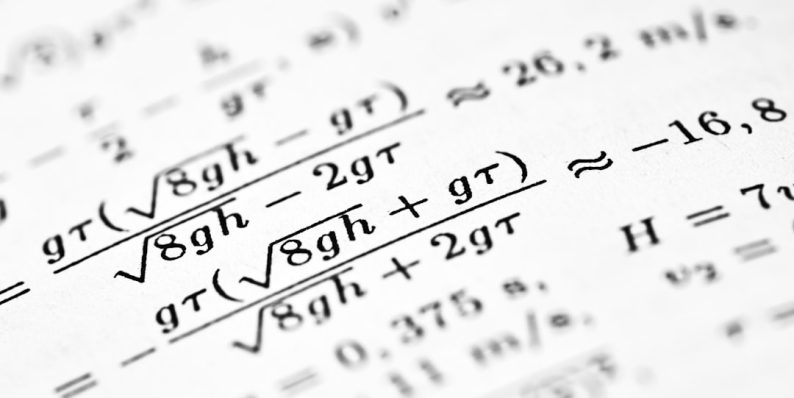 Mathematical formulas are written on a white sheet of paper. math formulas, academic books, financial systems