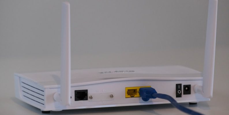 white router on white table wifi router modem ethernet cable streaming fix