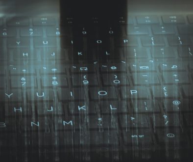 A computer keyboard with a sky background weird text, keyboard typo, alien gibberish