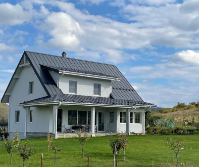 a house with a large yard green buildings, energy efficiency, solar panels