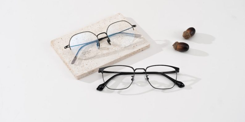 A pair of glasses sitting on top of a white table nuance audio glasses, smart eyewear, bluetooth device, stylish frames A pair of glasses sitting on top of a white table nuance audio glasses, smart eyewear, bluetooth device, stylish frames