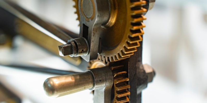 Gears interlock, showing intricate mechanical design. cnc machine, acrylic part, spindle, cutting