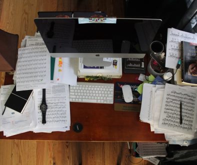 silver iMac with Magic Mouse and Keyboard people organizing files computer teamwork paperless