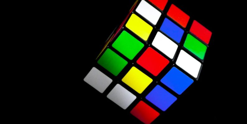 3 x 3 rubiks cube mobile puzzle game screen, colorful block grid, combo clear effect