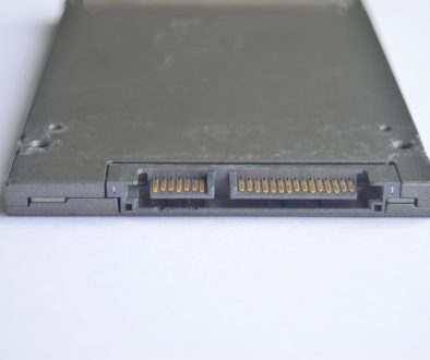 A close up of a laptop on a white surface laptop open back panel ram slot installation