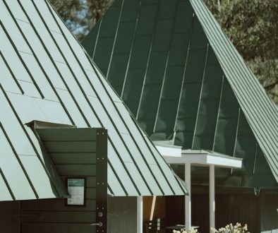 a group of tables and chairs outside of a building natural slate roof,synthetic roofing,aesthetic house design