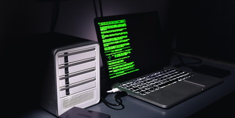 a laptop and a computer computer malware icons, warning screen, digital security illustration