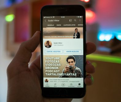 a person holding a cell phone in their hand person choosing profile picture on phone, social media app interface, smartphone screen close up