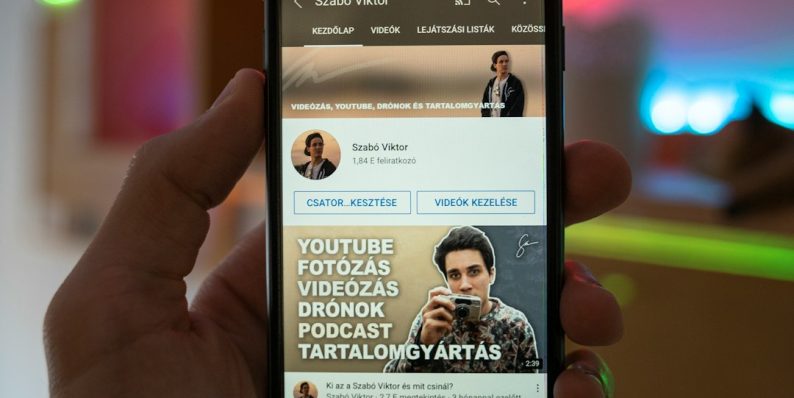 a person holding a cell phone in their hand person choosing profile picture on phone, social media app interface, smartphone screen close up